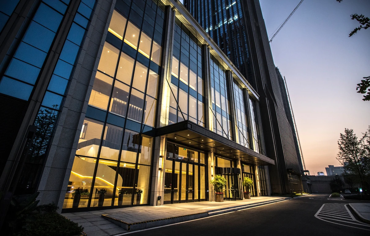 Commercial building entrance illuminated at dusk